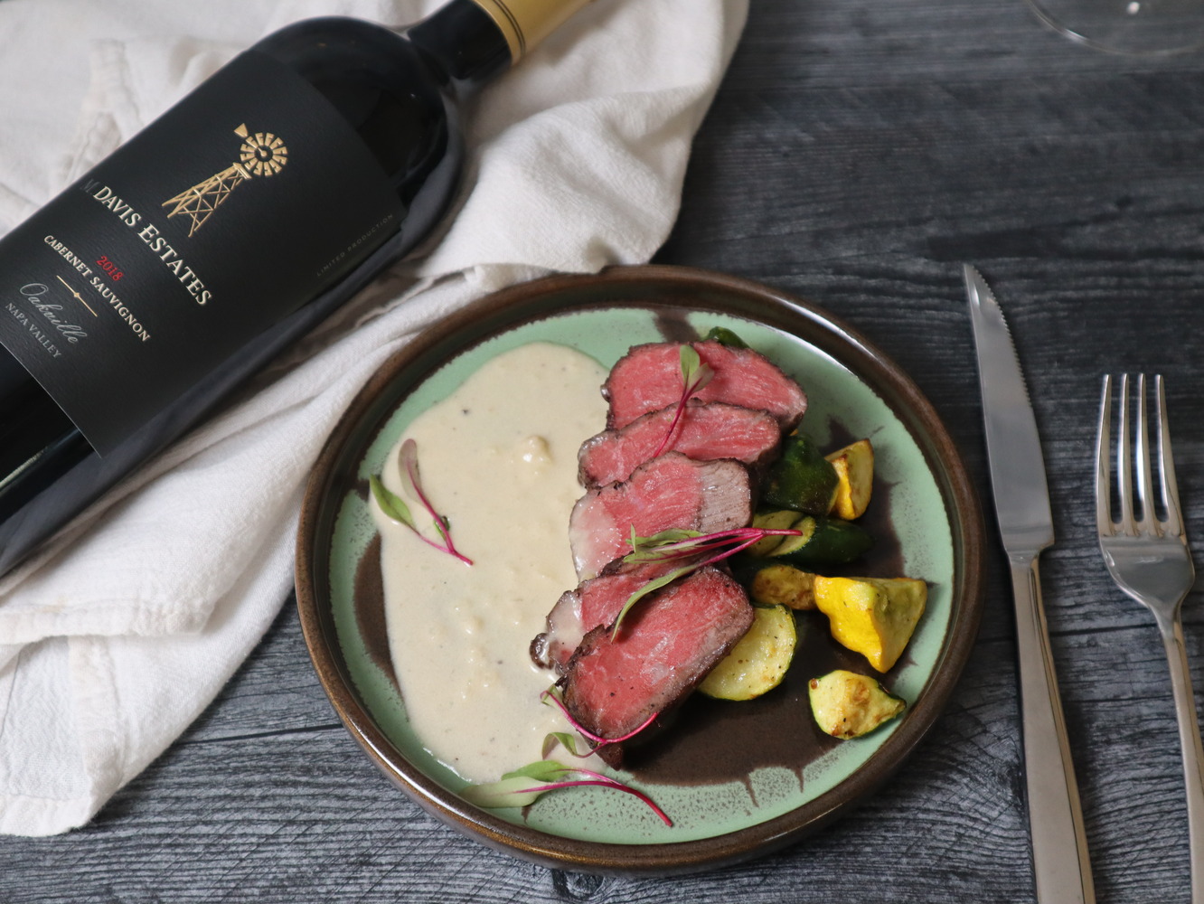 a sumptuous steak meal paired with Davis Estate wine