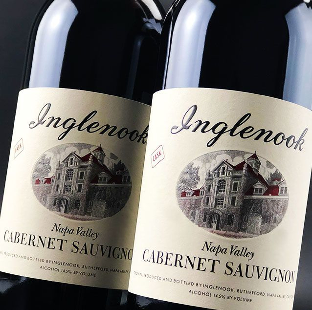 Two bottles of Inglenook Napa Valley Cabernet Sauvignon with estate illustration.