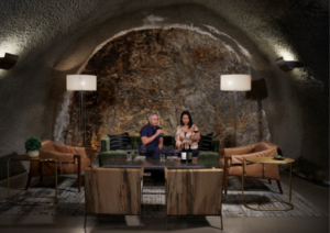 Wine tasting inside an elegant, cave-like room with cozy seating.